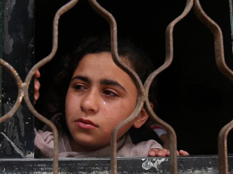 A Relative of 19-year-old Palestinian Anas Abu Aser, who died a week after being shot by Israeli soldiers during protests on the Gaza-Israel border, cries during his funeral in Gaza City on May 3, 2018. (MOHAMMED ABED / AFP)