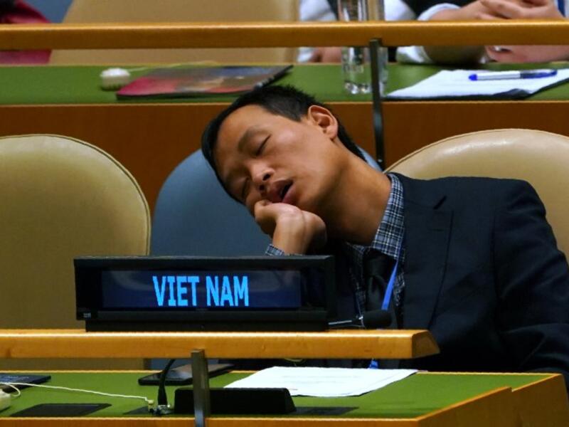 A member of Vietnamese delegation naps during the General Debate of the 73rd session of the General Assembly at the United Nations in New York September 25, 2018. 
Don EMMERT / AFP