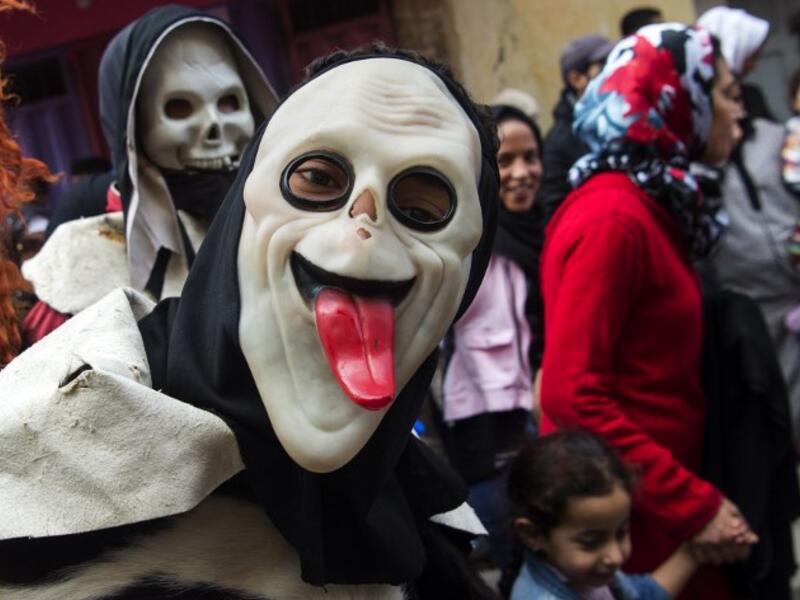 Young Moroccans take part in the Boujloud festival, a popular celebration also known as the 'Moroccan Halloween' in the Sidi Moussa district of Sale near Rabat, on October 27, 2018. 
FADEL SENNA / AFP