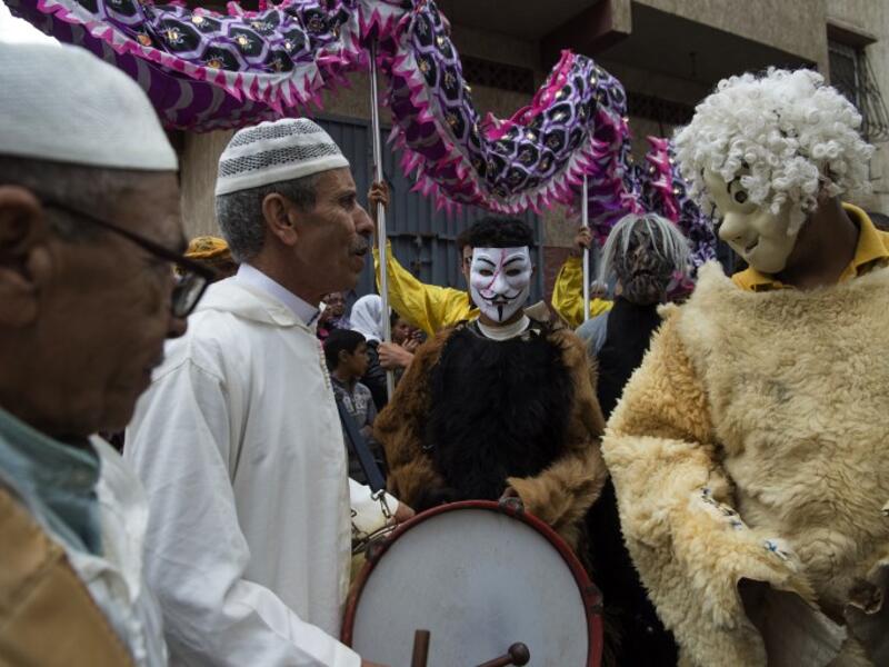 Young Moroccans take part in the Boujloud festival, a popular celebration also known as the 'Moroccan Halloween' in the Sidi Moussa district of Sale near Rabat, on October 27, 2018. 
FADEL SENNA / AFP