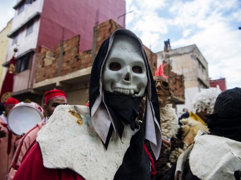 Young Moroccans take part in the Boujloud festival, a popular celebration also known as the 'Moroccan Halloween' in the Sidi Moussa district of Sale near Rabat, on October 27, 2018. 
FADEL SENNA / AFP