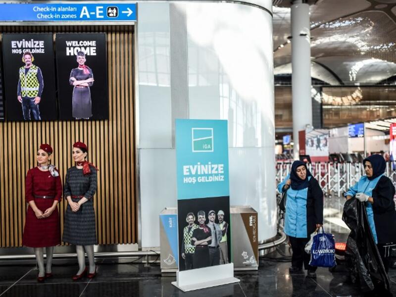 Hostes and workers are seen during the opening ceremony of the new airport building during a opening ceremony of Istanbul's third airport, the Istanbul New Airport, in the Arnavutkoy district on the European side of Istanbul on October 29, 2018. 
BULENT KILIC / AFP