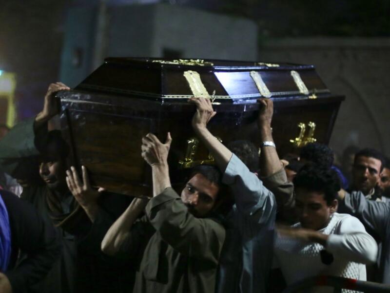 Egyptian relatives and friends of Christian Assad Labib, 35 year old, carry his casket during his funeral at the Anglican Church in Sawaada village near Minya city early on November 3, 2018. 
STR / AFP