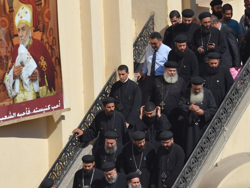 Coptic Christian priets leave the Prince Tadros church in Egypt's southern Minya province, following a morning ceremony for victims killed in an attack a day earlier, on November 3, 2018. 
MOHAMED EL-SHAHED / AFP