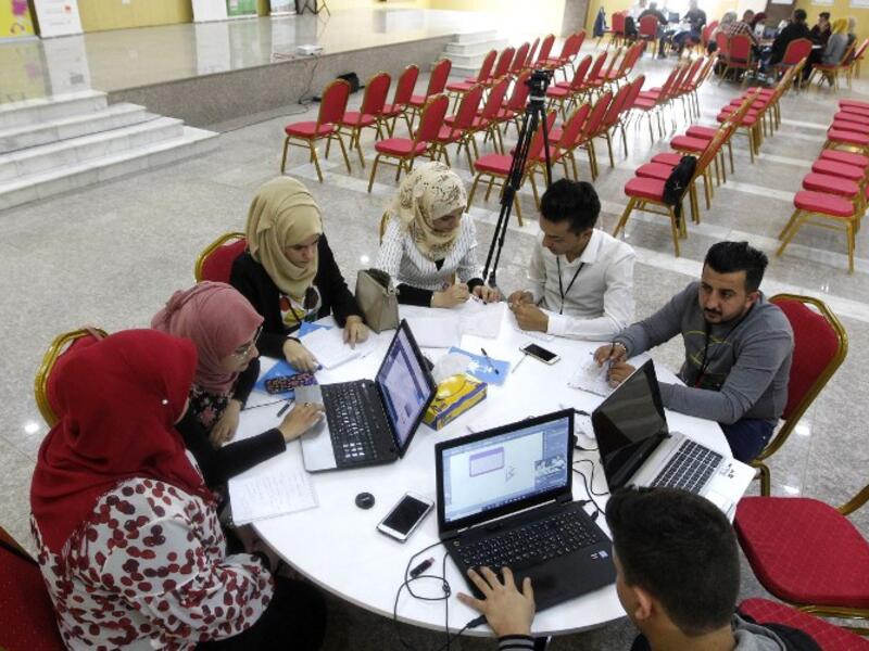 Iraqi youths work at "The Station", Baghdad's incubator for would-be entrepreneurs, in the Iraqi capital on November 17, 2018.
SABAH ARAR / AFP