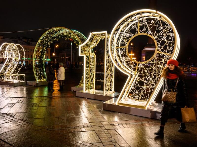 A woman walks in front of an illuminated "2019" sign on a square in central Moscow on December 30, 2018, ahead of the new year. 
Mladen ANTONOV / AFP