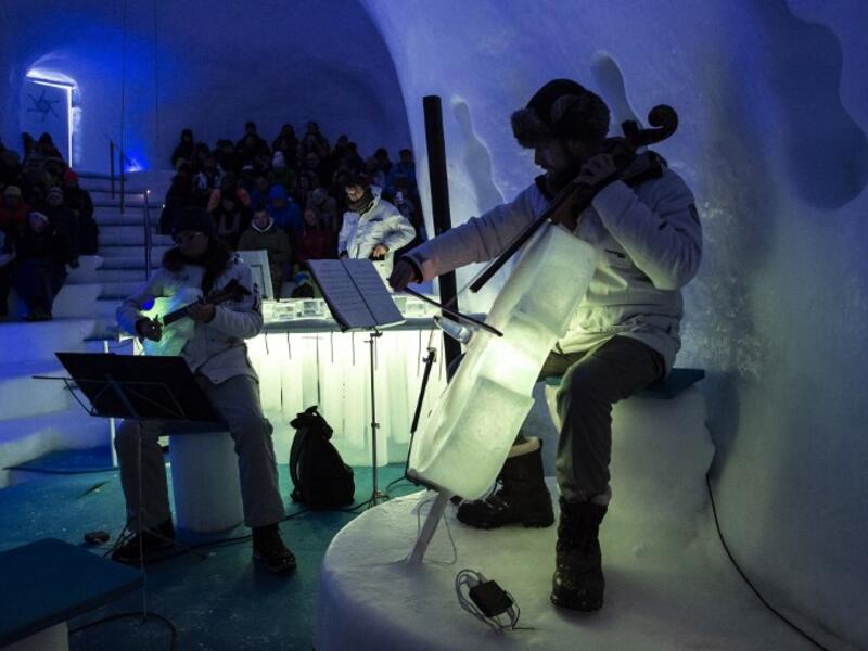 Musicians perform with ice instruments during a concert in the "Ice Dome" on Presena Galcier, Tonale Pass, near Trento in northern Italy on January 17, 2018.
MARCO BERTORELLO / AFP