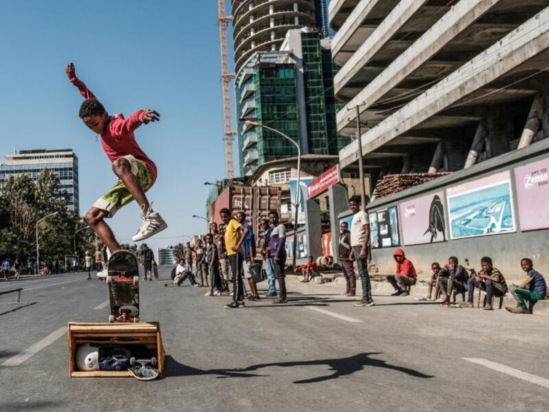 A skateboarder perfoms on a street in Addis Ababaon February 3, 2019 during the third Car Free Day promoted by local NGOs and the Ethiopian Government to appeal a healthy life style and a less air pollution of the capital city. 
EDUARDO SOTERAS / AFP