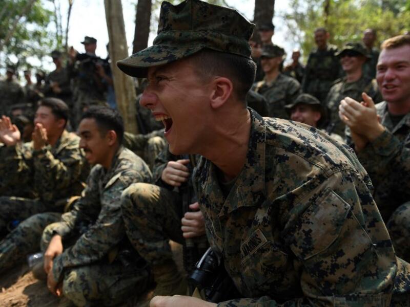 US Marine react during a jungle survival training with Thai soldiers in the joint 'Cobra Gold' military exercise in Chantaburi province 
Lillian SUWANRUMPHA / AFP