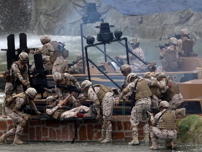 Members fo the UAE Armed forces perform a military drill during the opening of the International Defence Exhibtion and Confrence at the Abu Dhabi National Exhibtion Centre on February 17, 2019. 
AFP