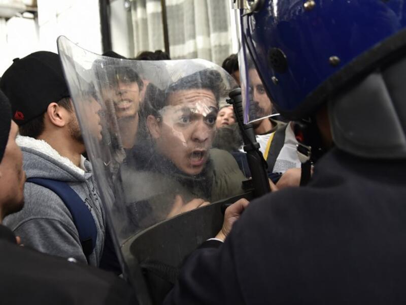 Algerian students scuffle with security forces during a protest in the capital Algiers against ailing President Abdelaziz Bouteflika's bid for a fifth term
RYAD KRAMDI / AFP