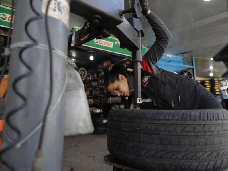 Amina repairs a flat tyre at a car tyre's repair shop in Beirut on March 8, 2019. Amina has been working for 10 years in mechanics, specially in the tyres repair business. She considers it fulfilling as she always dreamt of doing that job.
JOSEPH EID / AFP
