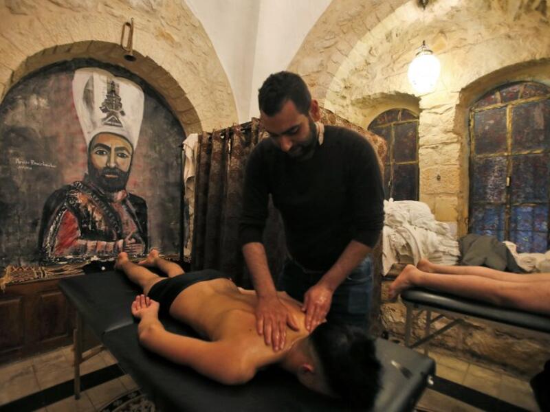 A man get a massage at the first traditional Turkish bath (Hammam) opening in the occupied Palestinian West Bank city of Hebron on March 11, 2019.
HAZEM BADER / AFP