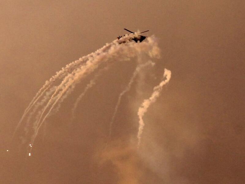 An Israeli helicopter shoots flares over the Gaza Strip on March 25, 2019. Israel launched strikes on Hamas targets in Gaza today hours after a rocket from the Palestinian enclave hit a house near Tel Aviv and wounded seven people, leading to fears of a severe escalation.
MOHAMMED ABED / AFP