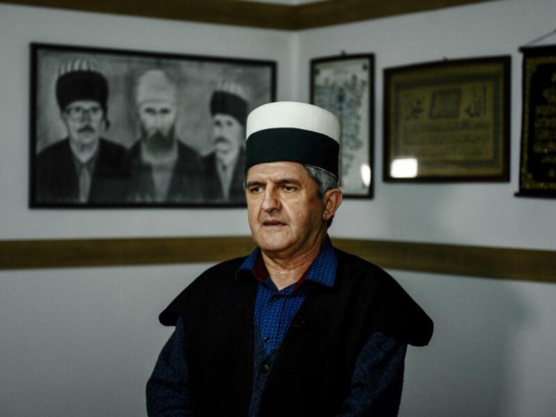 Albanian Dervish Agron Juniku speaks during an interview with AFP in Gjakova
Gent SHKULLAKU / AFP