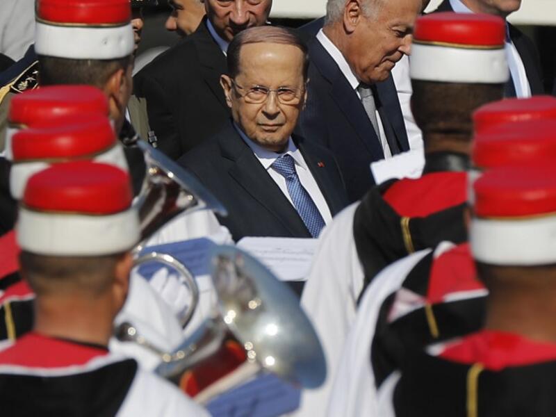 Lebanese President Michel Aoun reviews the honour guard upon his arrival at Tunis-Carthage international airport on March 30, 2019, to attend the Arab Summit tomorrow. 
Hussein Malla / POOL / AFP