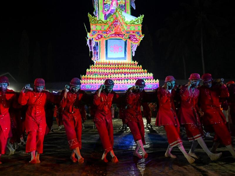 Traditional dancers perform during abbot Kay Lar Tha's funeral procession in Mudon, Mon State. 
Ye Aung THU / AFP