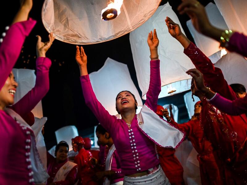 In this picture devotees release lanterns near a makeshift palace during abbot Kay Lar Tha's funeral in Mudon, Mon State. 
Ye Aung THU / AFP
