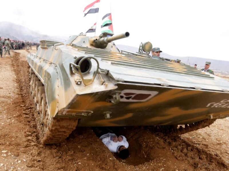 Syrian volunteers take part in paramilitary training conducted by the Syrian army in al-Qtaifeh, 50 kms north of the capital Damascus on February 22, 2016. (AFP/Louai Beshara)