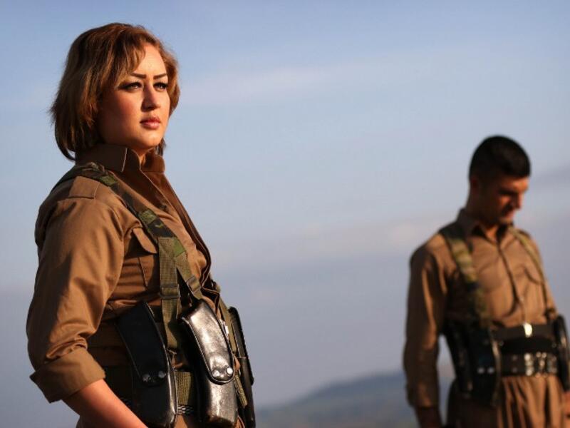 Iranian Kurdish Peshmerga members of the Kurdistan Democratic Party of (KDP-Iran), take part in a training as they prepare to celebrate Noruz, the Persian New Year, in the town of Koya, 100 kms north of Arbil, the capital of the autonomous Kurdish region of northern Iraq, on March 19, 2016. (AFP/Safin Hamed)