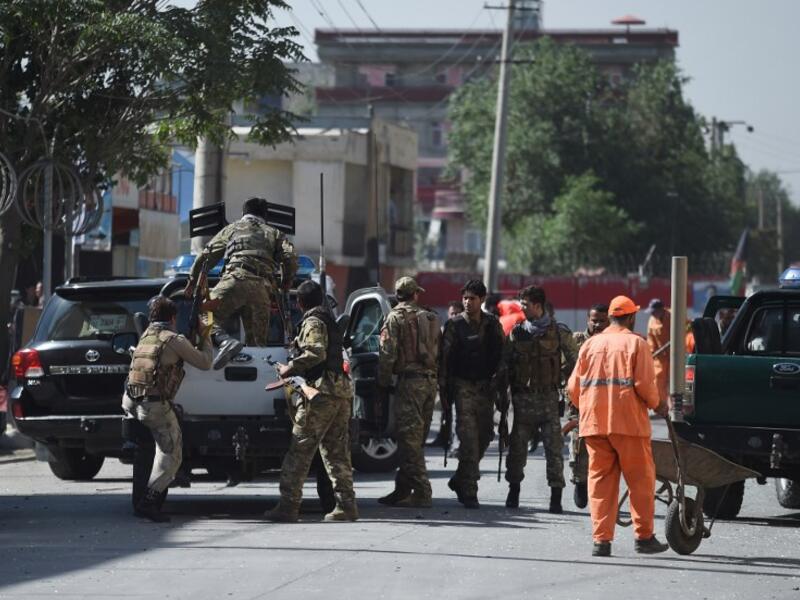 Security forces in Kabul leave the site of Monday's bombing. (WAKIL KOHSAR / AFP)