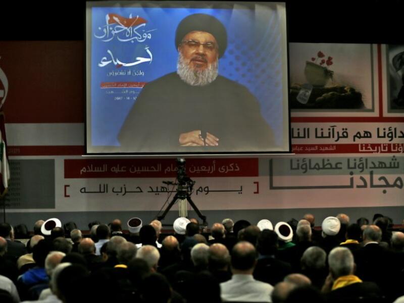A picture taken on Nov. 10, 2017, shows Hassan Nasrallah, the head of Lebanon's militant Shiite movement Hezbollah, giving a televised address during a gathering in Beirut's southern suburb. 

Nasrallah said Saad Hariri, who resigned as Lebanese prime minister from Riyadh last week, was "detained" by Saudi Arabia.

(ANWAR AMRO / AFP)