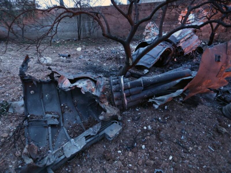 A picture taken on Feb. 3, 2018, shows parts of a downed Sukhoi-25 fighter jet in Syria's northwest province of Idlib. Rebel fighters shot down a Russian plane over Syria's northwest Idlib province and captured its pilot, the Syrian Observatory for Human Rights said. (OMAR HAJ KADOUR / AFP)