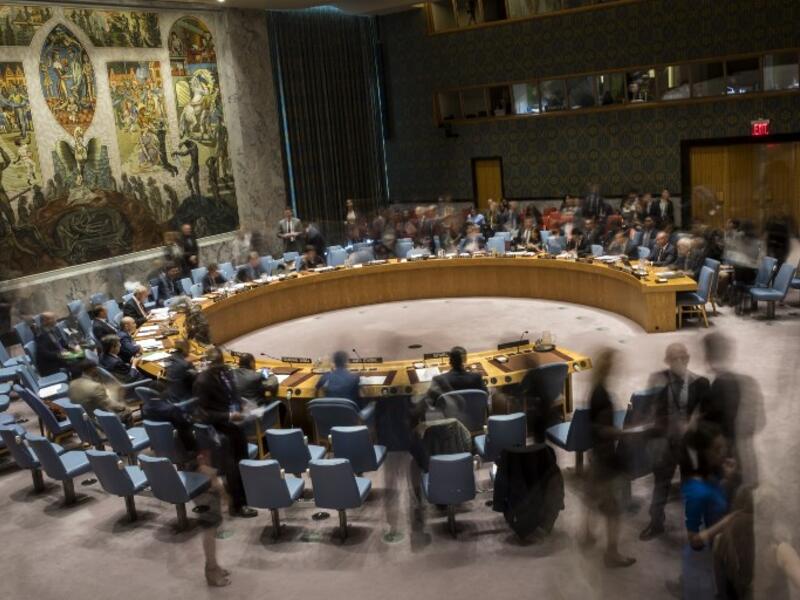 (FILES): In this long exposure photograph, the United Nations Security Council meets concerning the situation in the Middle East, at UN headquarters, April 26, 2018 in New York City. Israel claimed that Iran is using Syria to build a new military front against Israel. Among other topics discussed in the Security Council meeting included discussion about the mass protests along the border fence between the Gaza Strip and Israel. 
(Drew Angerer / GETTY IMAGES NORTH AMERICA / AFP)