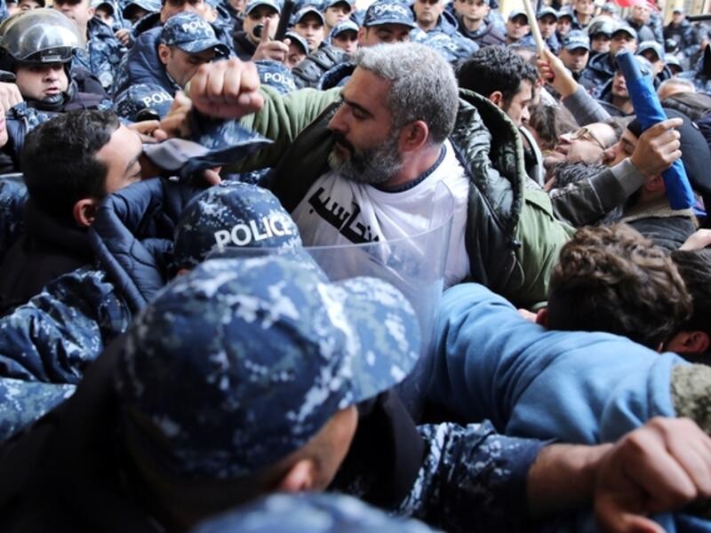 Internal Security Forces officer slapping an Electricité du Liban worker went viral over the weekend, sparking outrage and prompting the ISF to promise to open an investigation/AFP