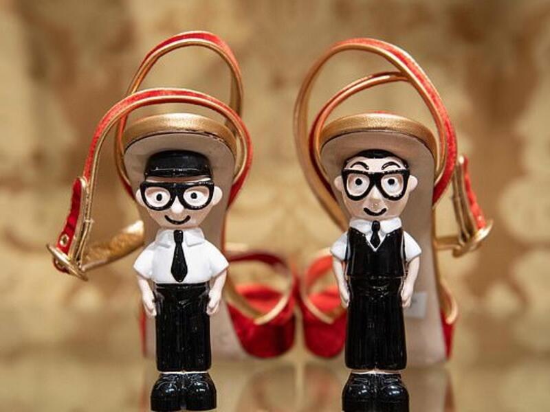 Shoes with the heels made out of figurines representing Italian fashion designers Domenico Dolce (left) and Stefano Gabbana are displayed at a store in Beijing (AFP)