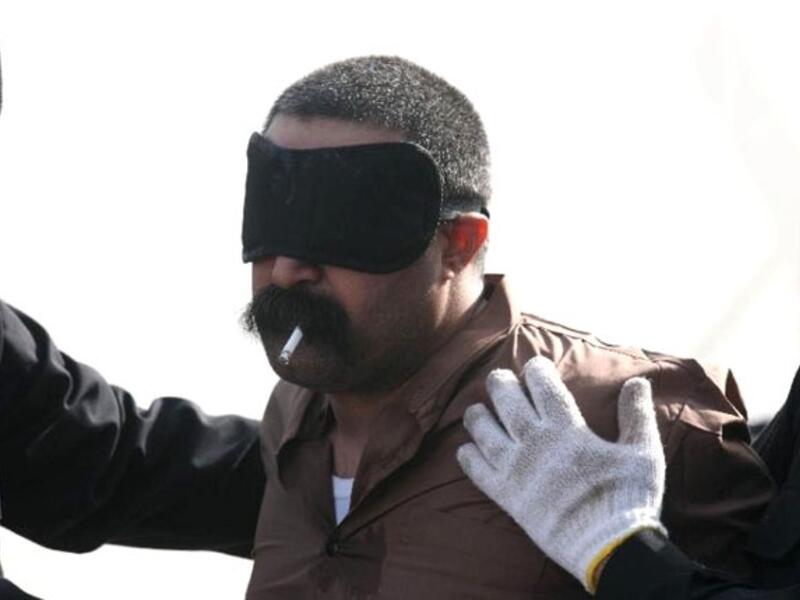 A Saudi national on death row smokes his last cigarette prior to being executed. (AFP/File)