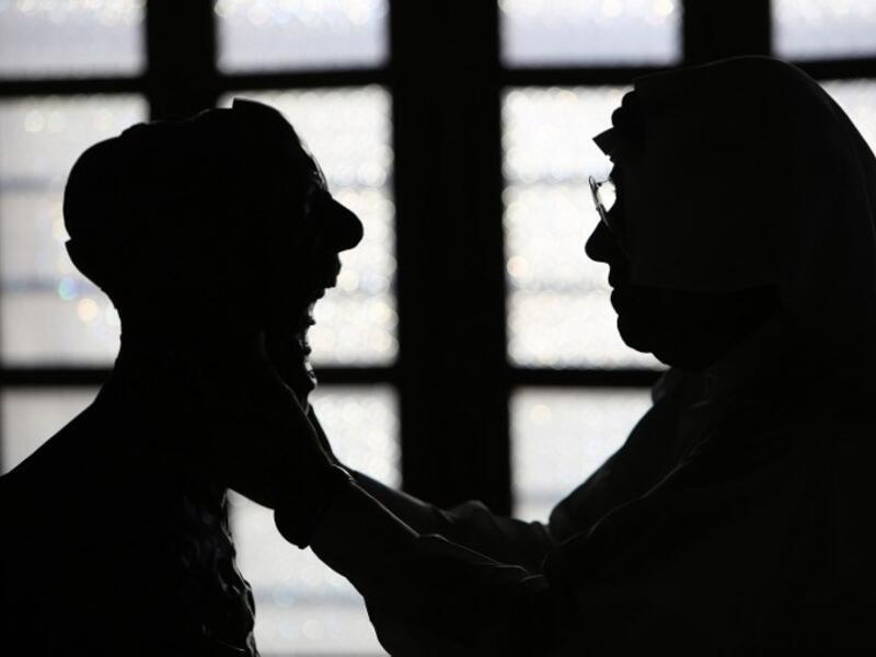 Kuwaiti sculptor Sami Mohammed poses with one of his works at the Museum of Modern Art in Kuwait City on October 4, 2018. 
Yasser Al-Zayyat / AFP
