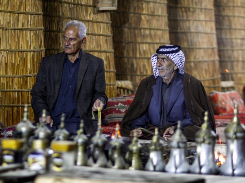 Members of an Iraqi clan gather inside a straw tent in the town of Mishkhab, south of Najaf on November 15, 2018. 
Haidar HAMDANI / AFP