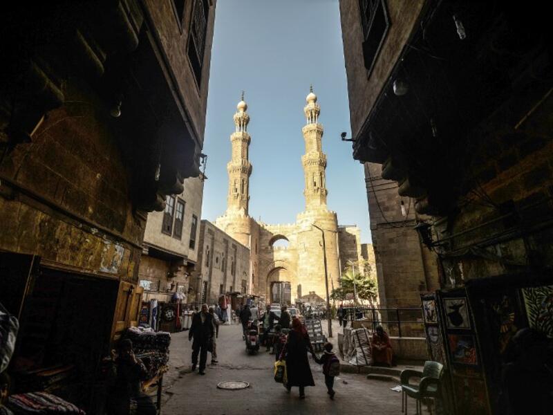 This picture shows a view from the entrance of Khayamiya Street, or the Street of Tent-makers, leading up to the 11th century Bab Zuweila, one of the surviving main gates of the old city of the Egyptian capital Cairo. 
Mohamed el-Shahed / AFP