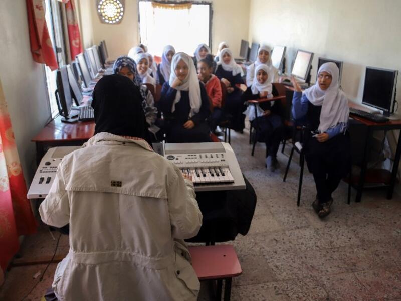 Children attend a music class at the Al-Nawras school in Taez, Yemen's third city, in the country's southwest
AHMAD AL-BASHA / AFP