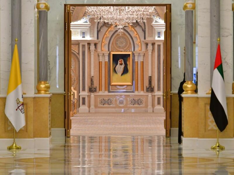 The national flags of Vatican (L) and United Arab Emirates are pictured at the presidential palace in the capital Abu Dhabi during a reception for Pope Francis, on February 4, 2019. 
Giuseppe CACACE / AFP