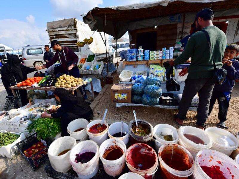 Street vendors sell pickles and vegetables in the souk or market of Al-Hol camp for displaced people in northeastern Syria
GIUSEPPE CACACE / AFP