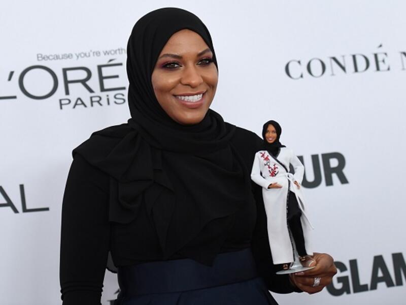 US Olympic medalist Ibtihaj Muhammad with her Barbie model. (AFP)