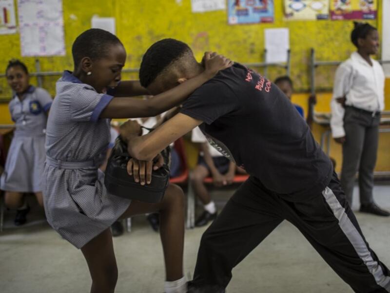 Girls practice self defence methods during a session with NGO Action Breaks Silence (ABS) called "Empowerment through self-defence for women and girls". (GULSHAN KHAN / AFP)