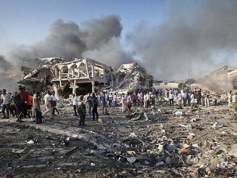 Somalis gather and search for survivors at the scene of a blast in the capital Mogadishu. (AFP)