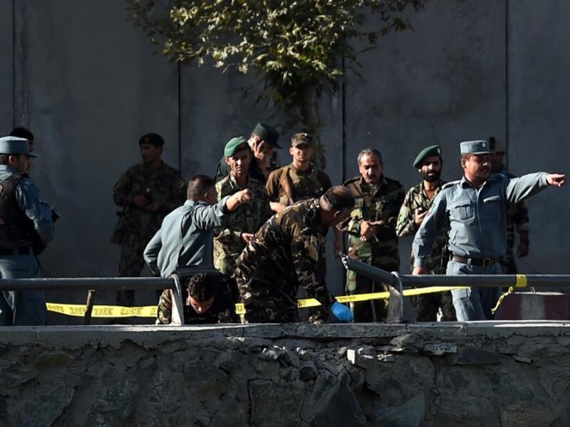 Afghan police examine the site of two suicide bombings in Kabul on September 5, 2016. (AFP/Wakil Kashar)