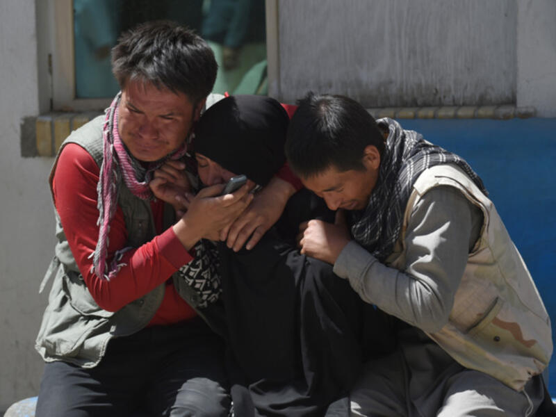 Afghan residents weeps for their relatives outside the Istiqlal Hospital in Kabul following the attack. (AFP)