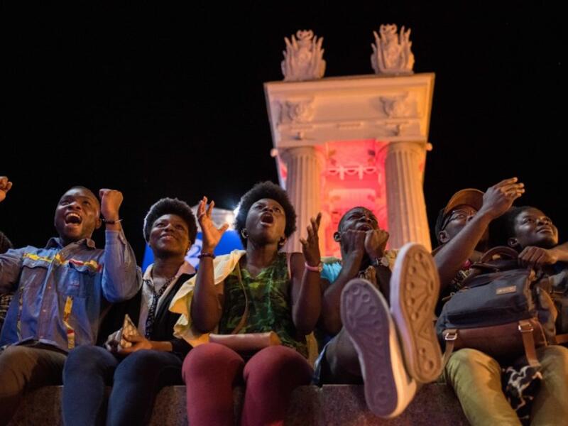 Nigerian football fans react as they watch the Russia 2018 World Cup Group D football match between Croatia and Nigeria on a giant screen at the official FIFA Fan Fest in Volgograd on June 16, 2018. 
NICOLAS ASFOURI / AFP