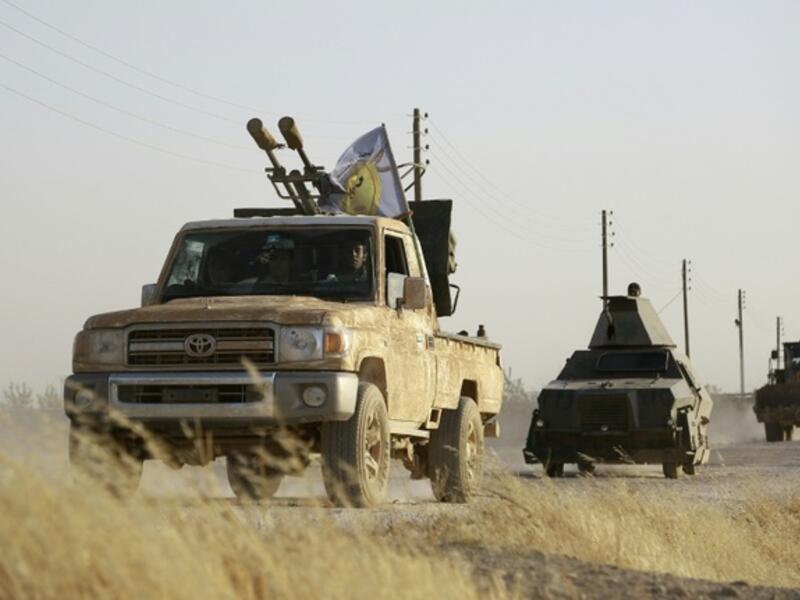 US-backed Kurdish and Arab fighters advance into the Daesh bastion of Manbij, in northern Syria, in June 2016. (AFP/File)