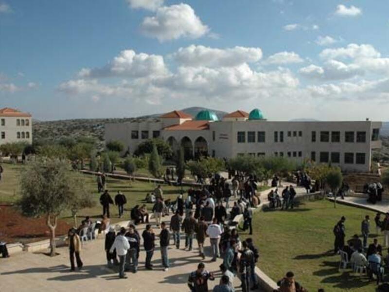 Students arrive at the Arab American University in Jenin, West Bank. (Wikimedia Commons)