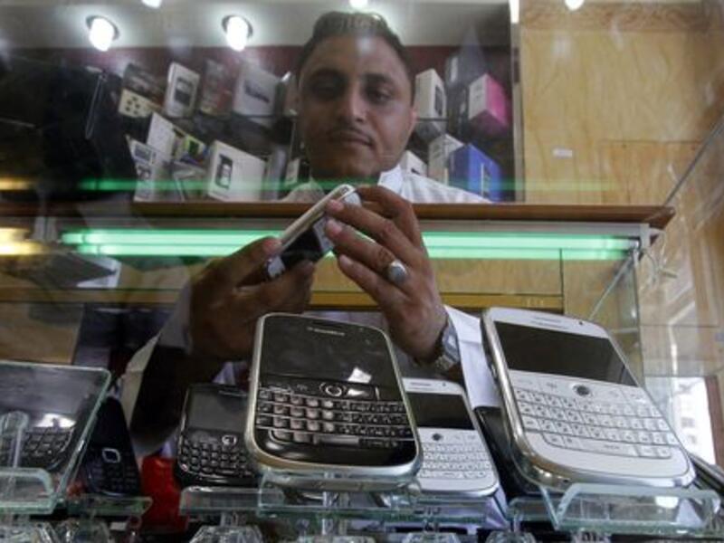 The Ministry of Commerce and Industry suspects up to 60 percent of mobile phone shops are cover-up businesses for expatriates. (AFP/File)