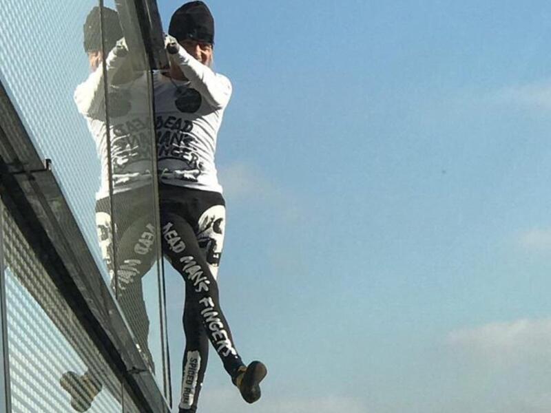 Human Spider-man shocks people by climbing tower in London without safety tools. (Twitter)