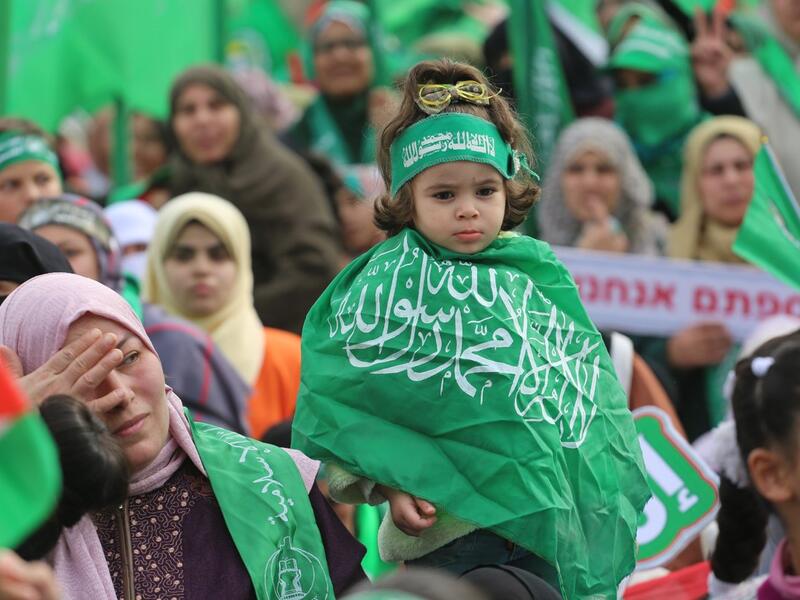 Palestinians attend a rally marking the 31st anniversary of Hamas' founding. (Twitter)