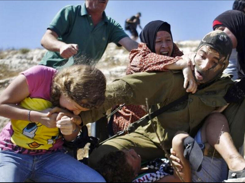 palestinian family attacks masked israeli soldier video