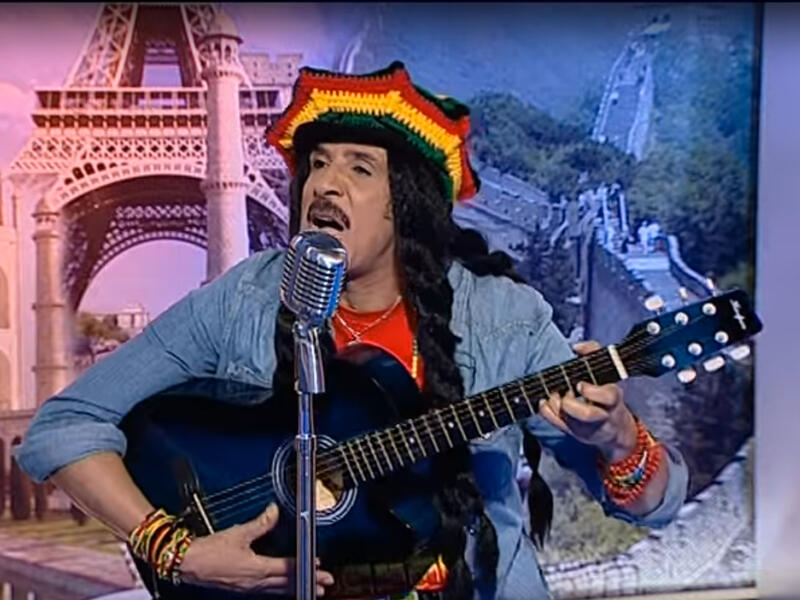 Emirati singer of indeterminable age, Abdullah Bilkhair, has a string of YouTube music videos. He channels Bob Marley in this one warbling "Buffalo Soldier". Online reviews generally panned the performance, 226 likes to 935 dislikes! You can't help but stare. (link: https://youtu.be/JH4B_cZsBmY)